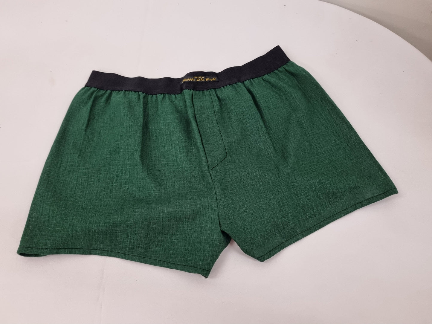 Green LINEN men boxer short with black elastic.