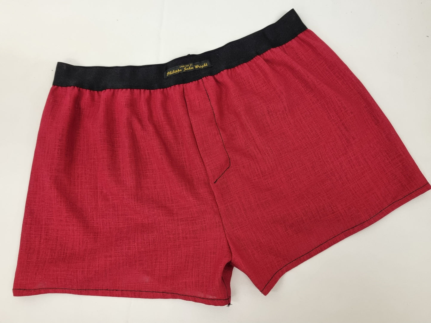 Red LINEN men boxer shorts with black elastic.