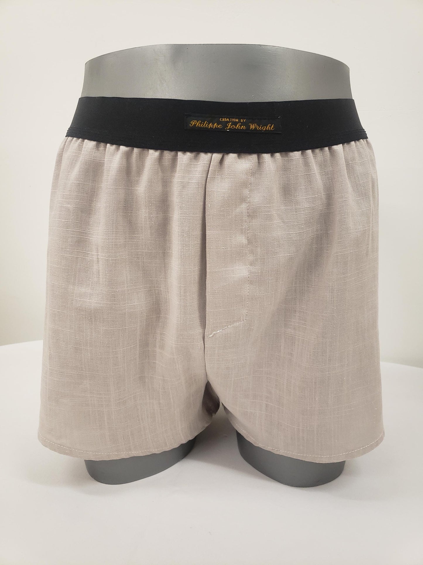 His and her BEIGE LINEN mens boxer shorts and womens linen boy shorts with black elastic.