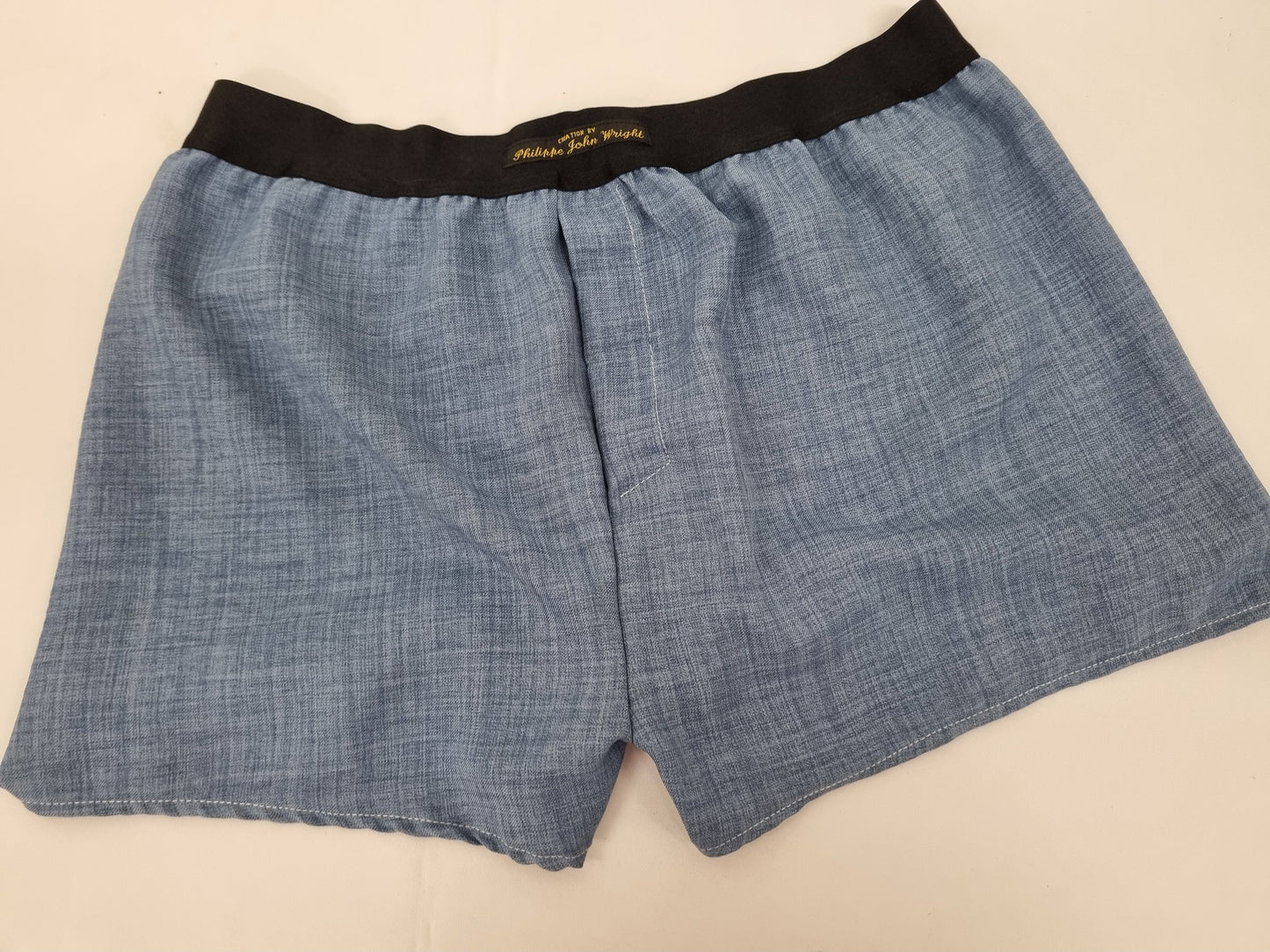 Blue LINEN men boxer shorts with black elastic.