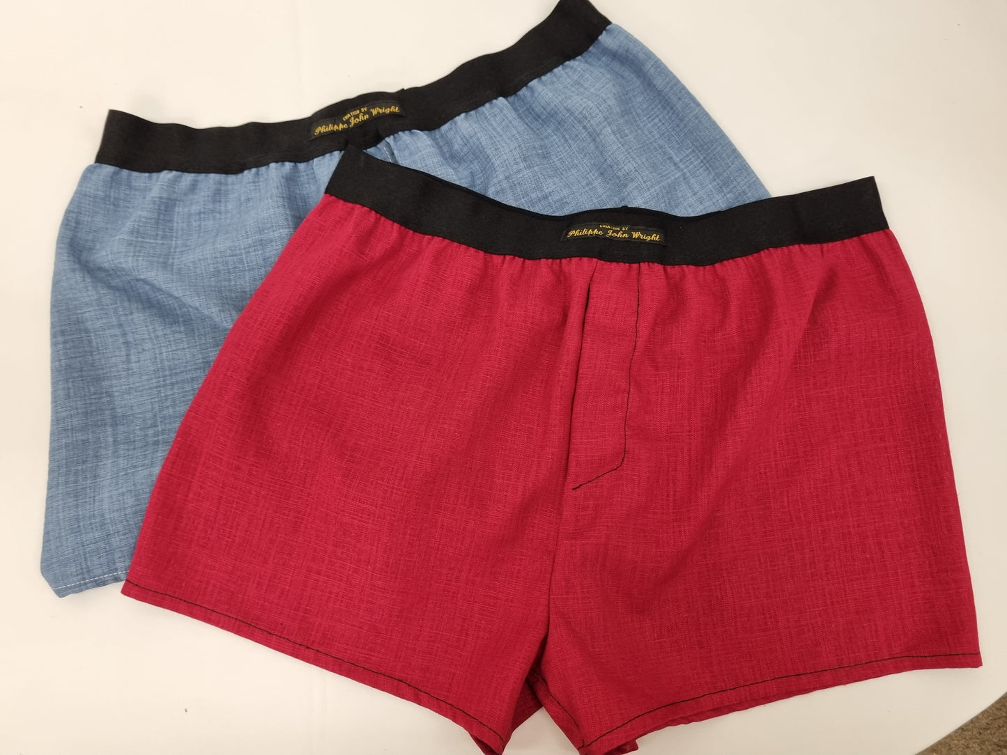 Two Red and blue LINEN men boxer short bundle with black elastic.