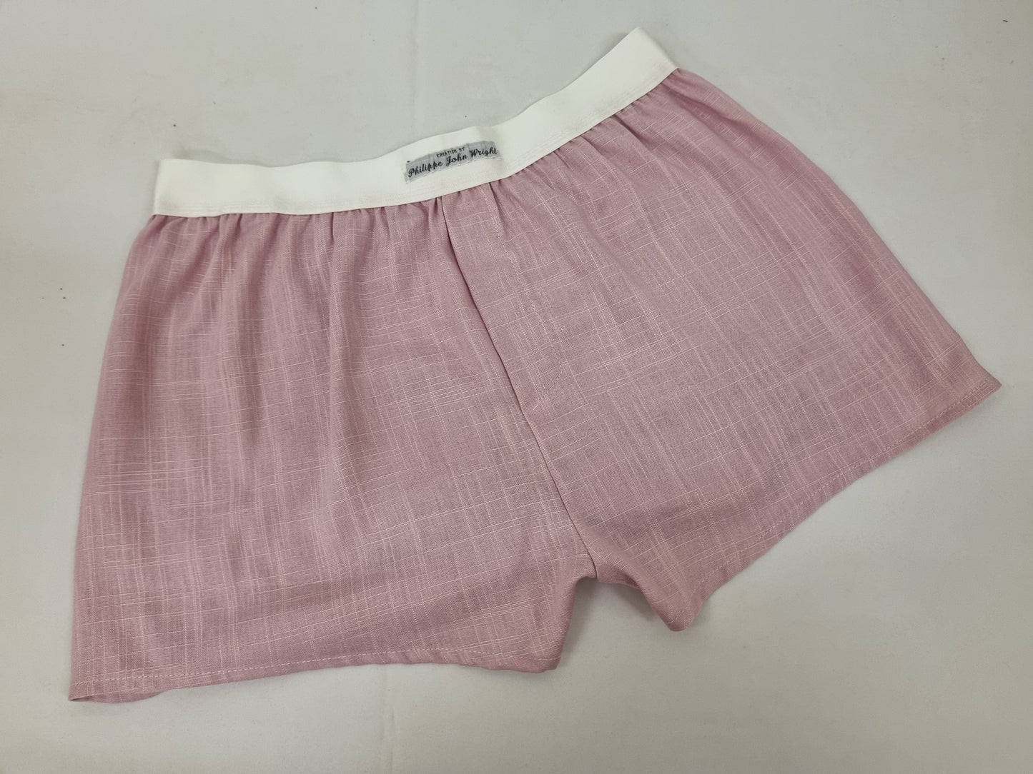 Pink LINEN men boxer short with white elastic.