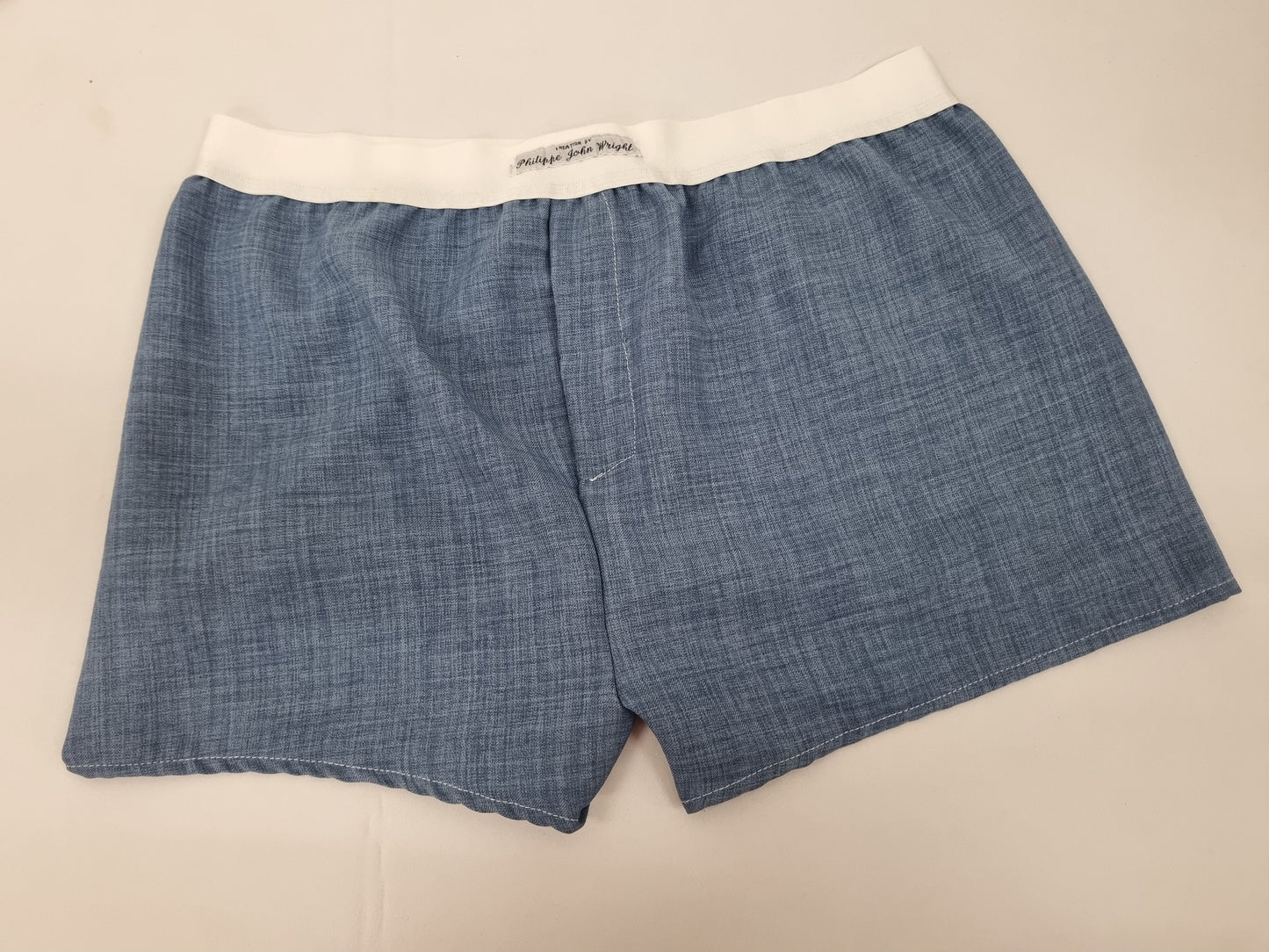 Blue LINEN men boxer short with white elastic.