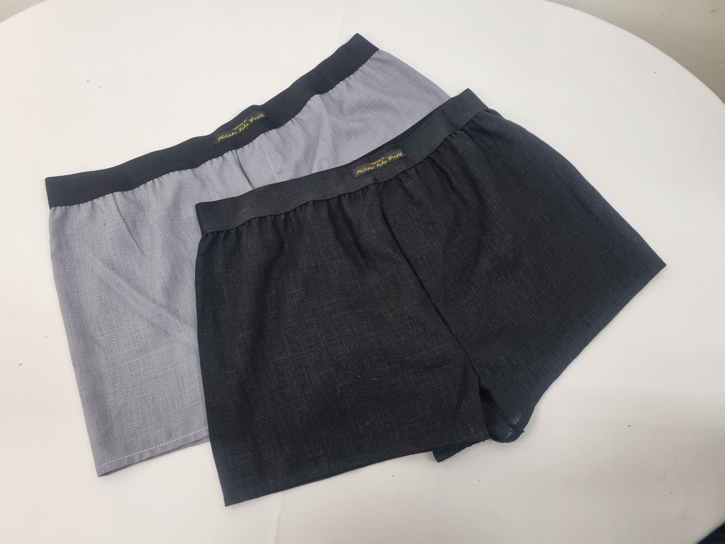 Two GRAY and BLACK LINEN men boxer short bundle with white elastic.