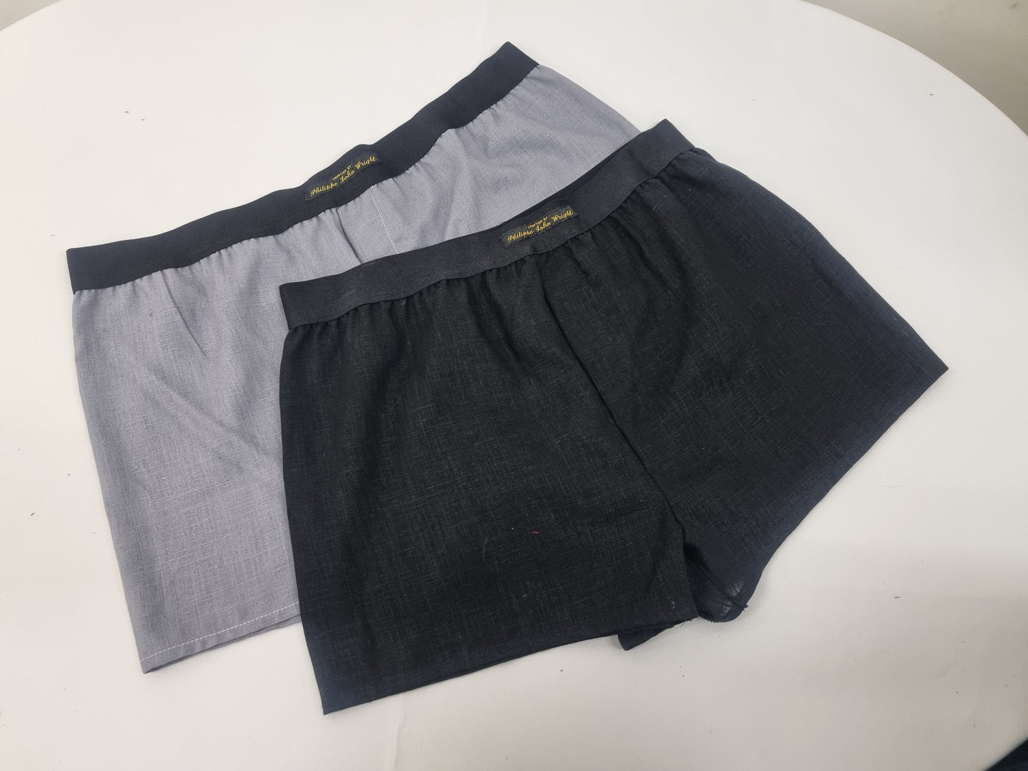 Two GRAY and BLACK LINEN men boxer short bundle with white elastic.