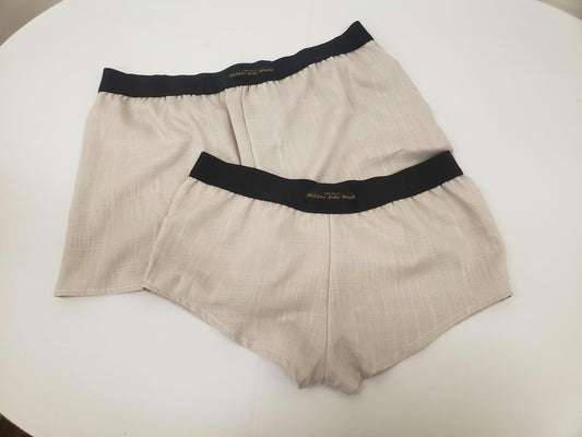 His and her BEIGE LINEN mens boxer shorts and womens linen boy shorts with black elastic.